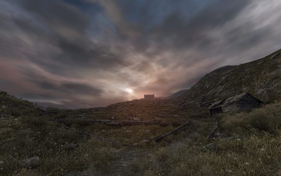 Screenshot from Dear Esther, showing a hillside covered with knee high stone walls.