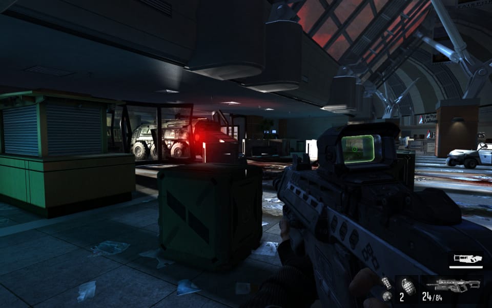 Screenshot from F.3.A.R., showing a armored truck crashed into the front doors of an airport
