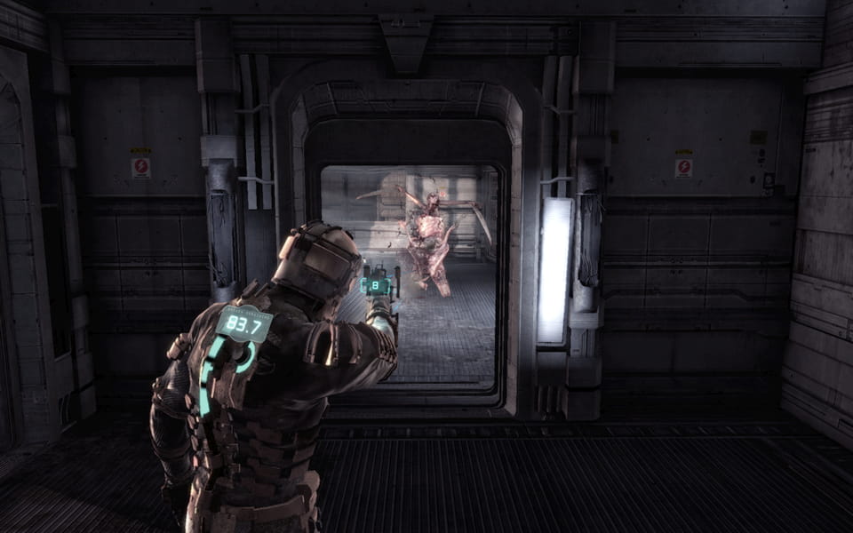 Screenshot of Issac shooting a necromorph.