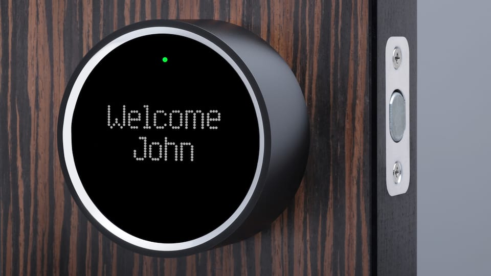 A smart lock, displaying 'Welcome John'